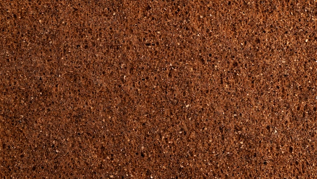 Rye bread texture close up, brown bread space