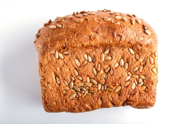 Rye bread with sunflower seeds isolated on white