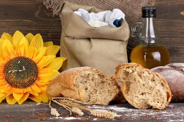 Rye bread on wooden table on wooden background