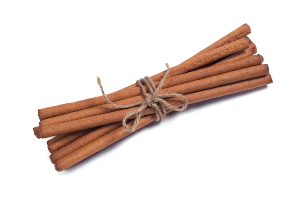 Rye breadsticks tied with a rope on a white background close up