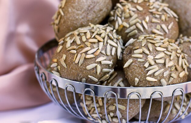 Rye buns with sunflower seeds in a wooden box