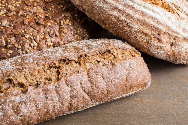 Rye homemade bread on a wooden table.