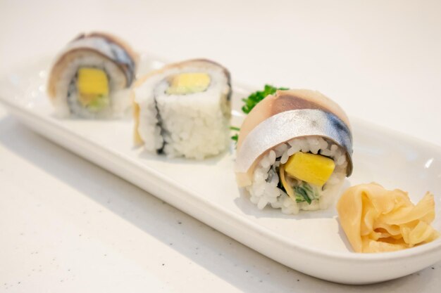 Saba sushi roll on white plate