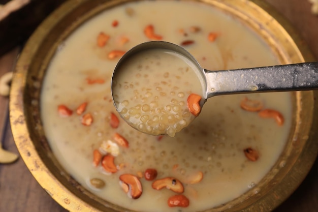 Sabudana kheer, sabudhana paayaasam indian traditional sweet closeup with selective focus and blur