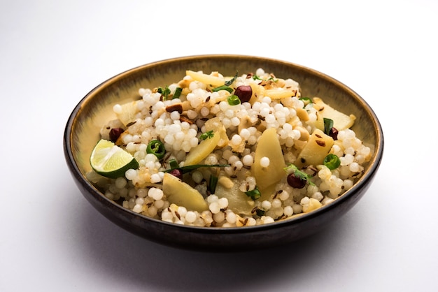 Photo sabudana khichdiãâ / khichadi is an indian fasting recipe or vrat food consumed during navratri, ekadashi or ganesh chaturthi