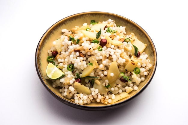 Photo sabudana khichdiãâ / khichadi is an indian fasting recipe or vrat food consumed during navratri, ekadashi or ganesh chaturthi