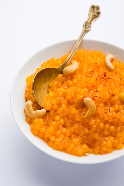 Sabudana or Sago Kesari dessert for Vrat Upvas also known as Sweetened Tapioca Pearl. served in a bowl. selective focus