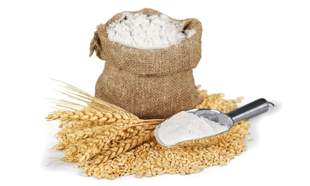 Sack of flour with wheat and scoop