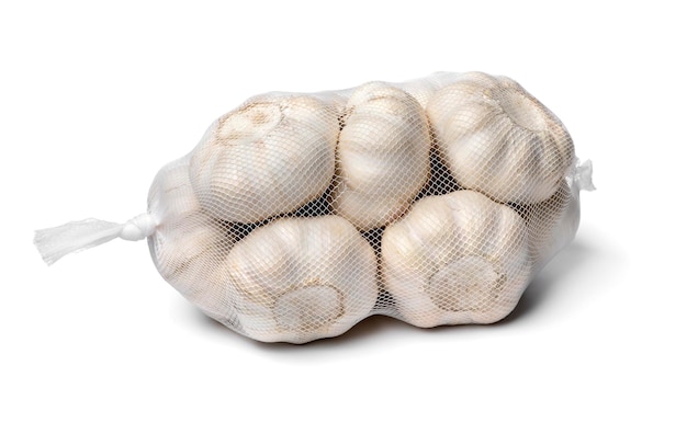 Photo sack with dried garlic bulbs close up on white background