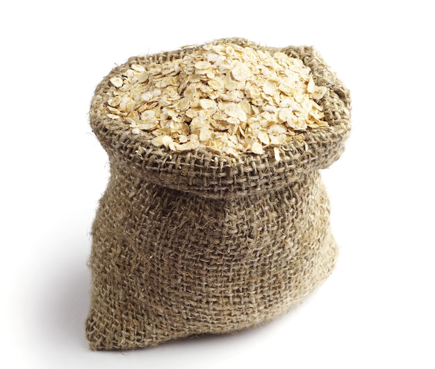 Sack with oat flakes on white