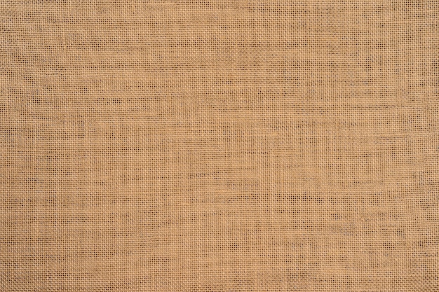 Sackcloth burlap woven texture background Organic linen fabric textile in beige sepia brown color