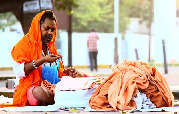 Sacred moments an orangerobed monk deep in meditation amidst nature's beauty