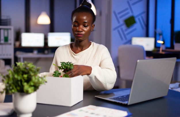 Sad african woman being fired during economy collapse, depressed, unhappy