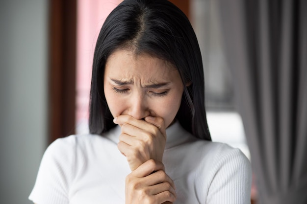 Sad asian girl crying portrait of frustrated depressed Chinese or east asian woman cries out with sadness or unhappiness young adult asian woman model