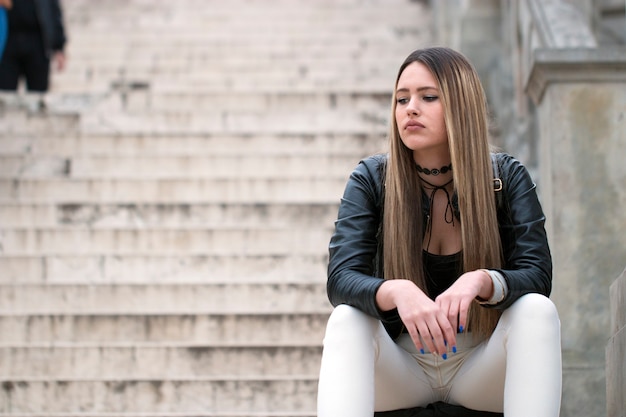 Sad and bored woman thinking about something.