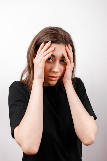 Sad brunette woman upset on white isolated