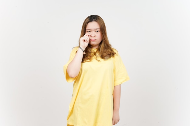 Sad Crying Face Expression of Beautiful Asian Woman wearing yellow TShirt Isolated On White