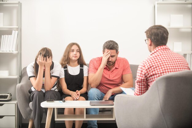 Sad father mother and child at family psychologist therapy