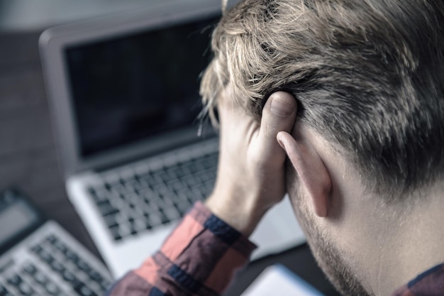 Sad man in desk