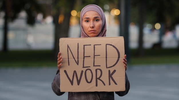 Sad muslim woman in hijab standing outdoors islamic ethnic girl upset unemployed worry stressful