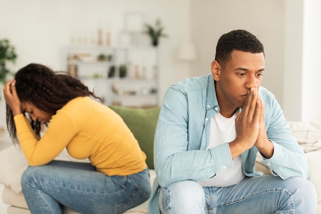 sad offended millennial african american wife and husband ignore each other after quarrel think about breakup