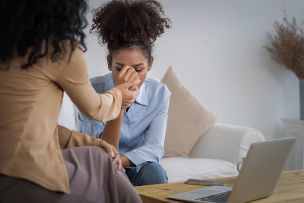 Photo sad ptsd woman patient in crucial therapy for mental health with psychologist