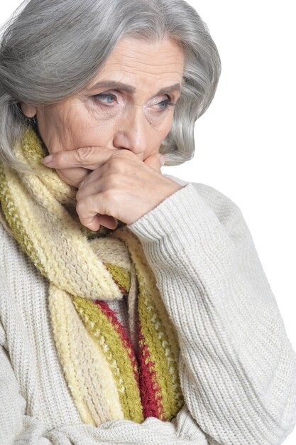 Sad senior woman isolated on white background