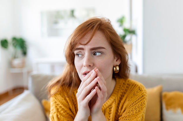 Sad woman feels miserable desperate sit on sofa look out the window thinking about personal troubles does not see way out of difficult life situation Break up heartbreak cheated girl concept