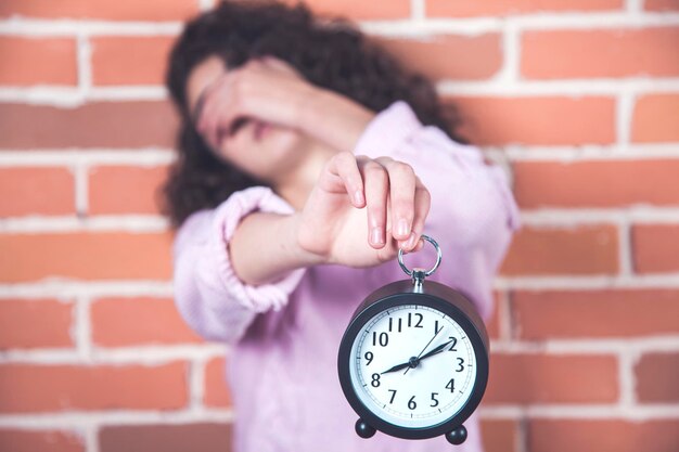 Sad woman hand clock