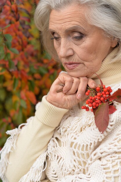 Sad woman posing with berries