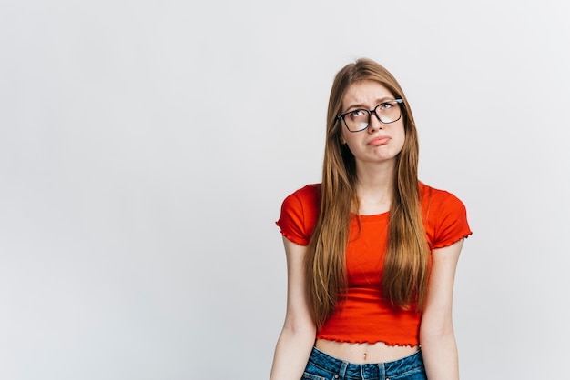 Sad woman wearing glasses with copy space