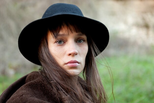 Sad woman with black hat 