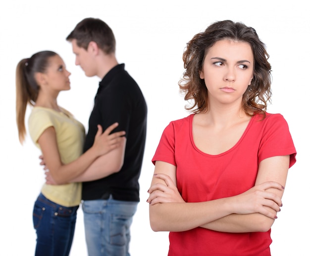 Sad women standing with her arms crossed.