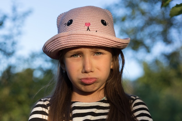 Sad young girl outdoors