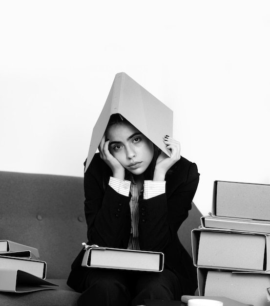 Sadness depressed businesswoman with folder on head frustration secretary girl stressed employee