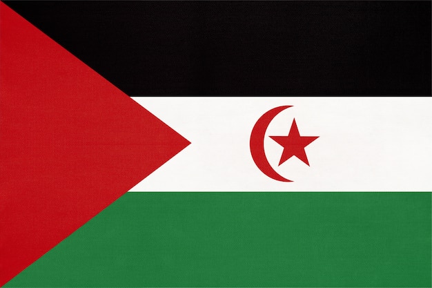 SADR national fabric flag, textile background. Symbol of world African country.