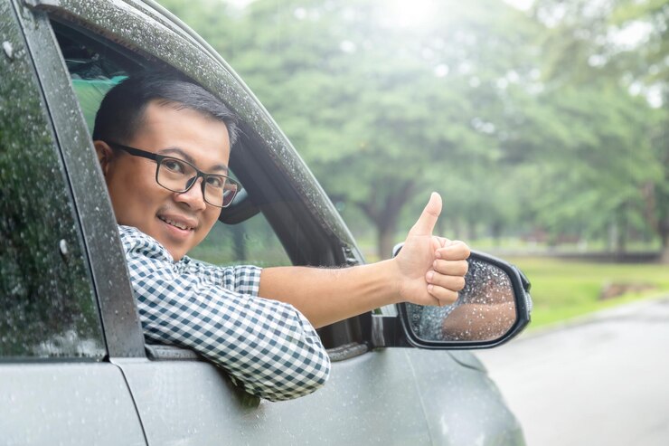 https://img.freepik.com/premium-photo/safe-drive-raining-day-smile-people-sitting-car-thumbs-up-camera_1048944-9615001.jpg?w=740