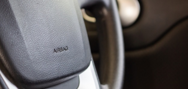 Safety airbag sign on car steering wheel