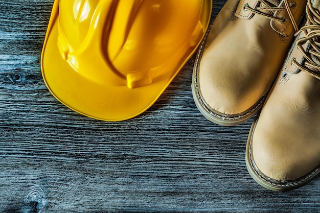 Safety boots cap on vintage wooden board