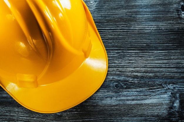 Safety hard hat on wooden board