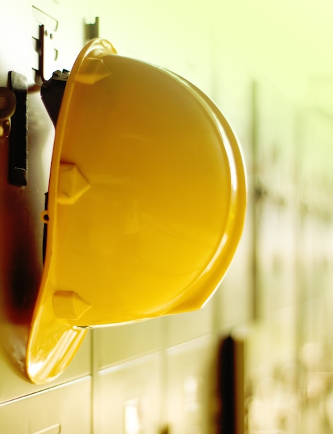 Photo safety helmet hanging on locker