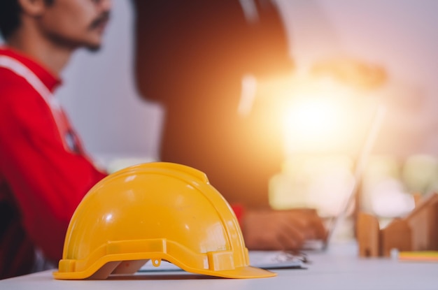 Safety helmet hard hat for safety project of engineer workman on table office