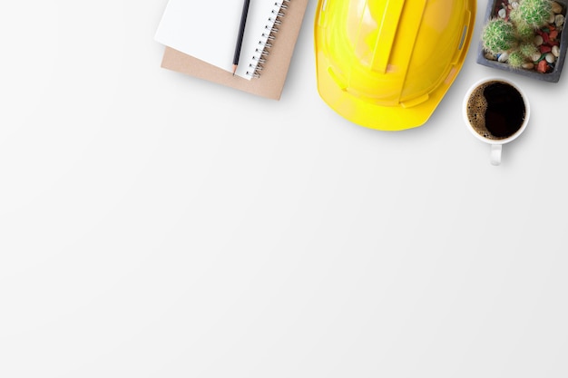 Photo safety helmet and notebooks on white background