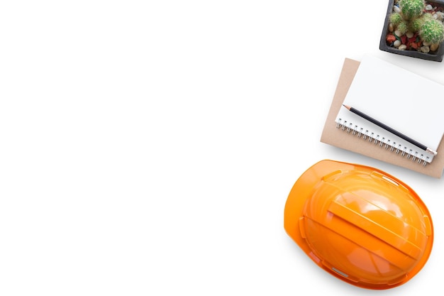 Safety helmet and notebooks on white background