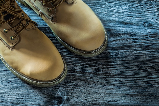 Safety lace boots on wooden board