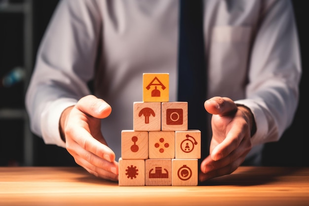 Safety at work concept Hand holds cubes wooden block with safety icons safety first protections health regulations and insurance Used for banner beautiful bright background and copy space