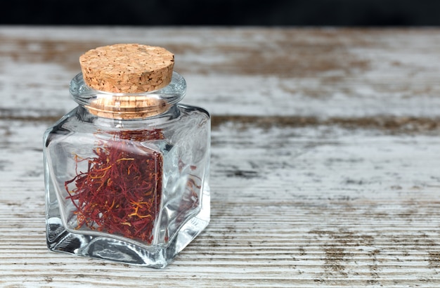 Photo saffron threads in a glass jar