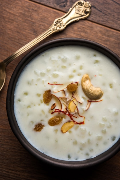 Sago Kheer or Sabudana Khir is a sweet food from India. Served in a bowl with spoon. Selective focus