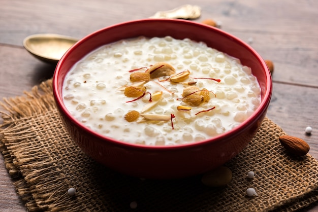Sago Kheer or Sabudana Khir is a sweet food from India. Served in a bowl with spoon. Selective focus