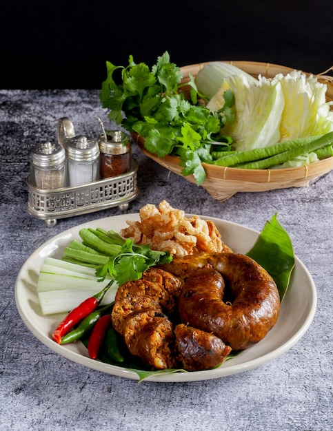 Sai Aua (Northern Thai Spicy Sausage) on a wooden surface